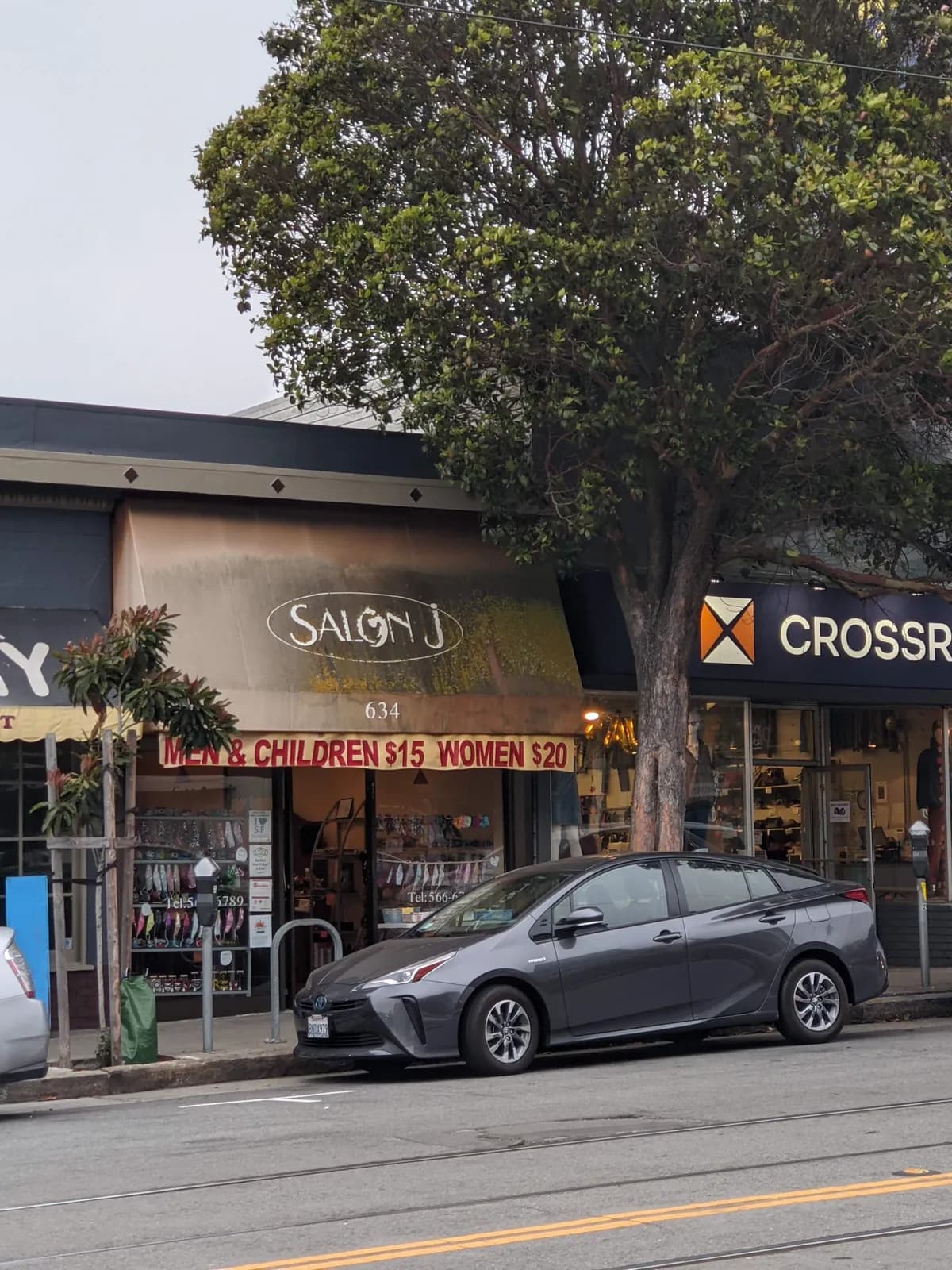 Salon J's storefront on Irving Street, seen across the N Judah tracks on a foggy afternoon
